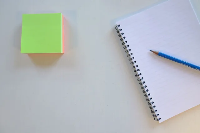 sticky, note, paper, notebook, pencil, work, desk, office, blue office, blue laptop, blue work, blue paper, blue desk, blue note. How to set evidence labels before choosing a creator media kit tool