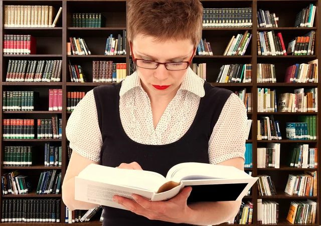 woman, person, read, head, bookshelf, knowledge, information, dialog, conversation, exchange, collected, library, dictionary, saved, communication, dictionary, dictionary, dictionary, dictionary, dictionary. Canva and Beacons on one creator media kit brief, with no winner declared